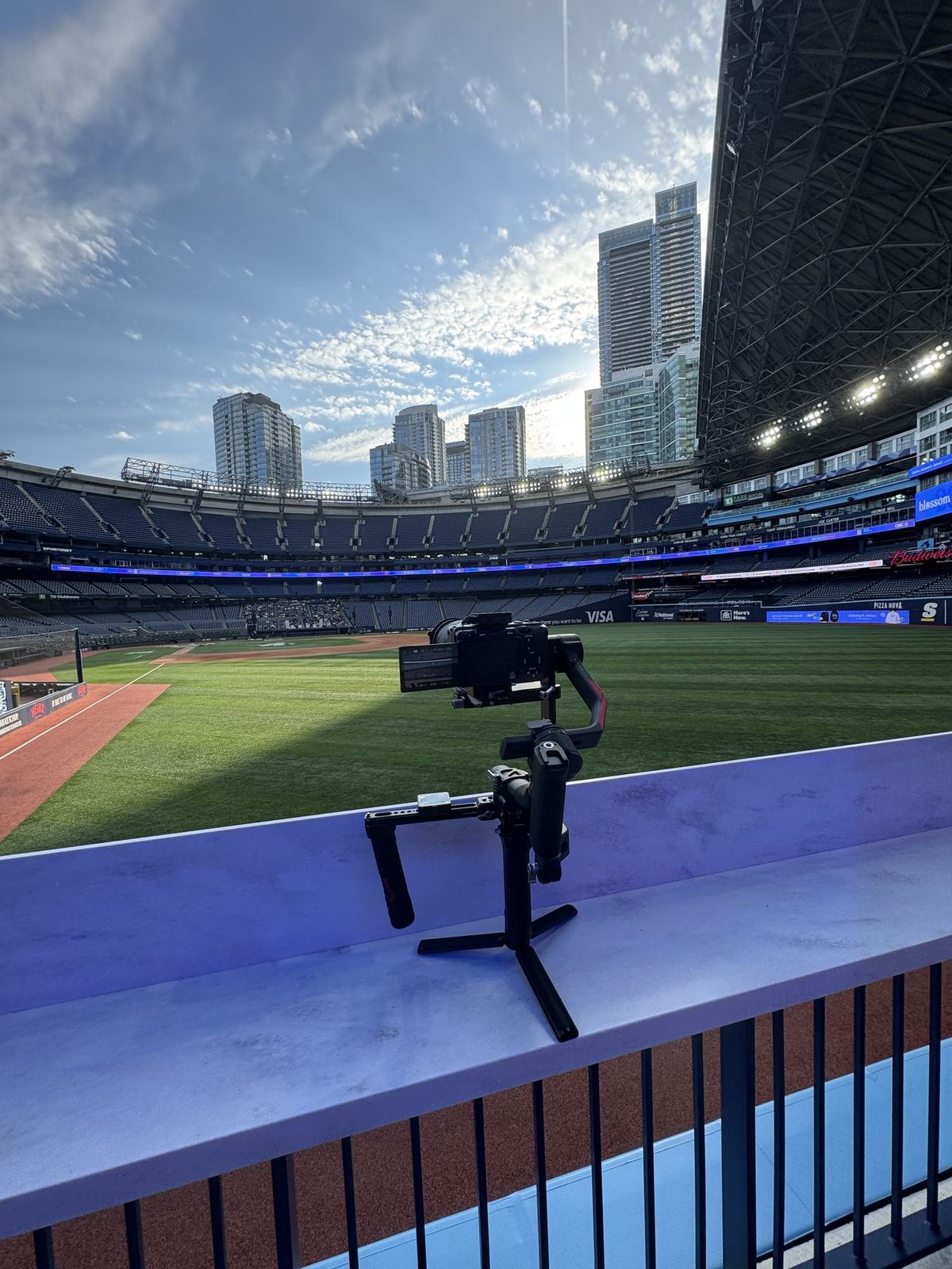 A camera on a rail overlooking a stadium field