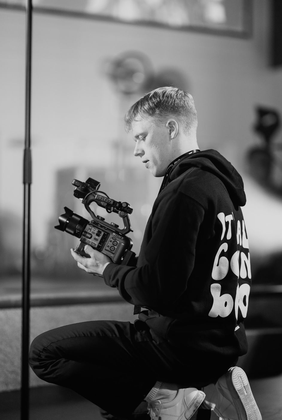 Noah checking a cinema camera on set