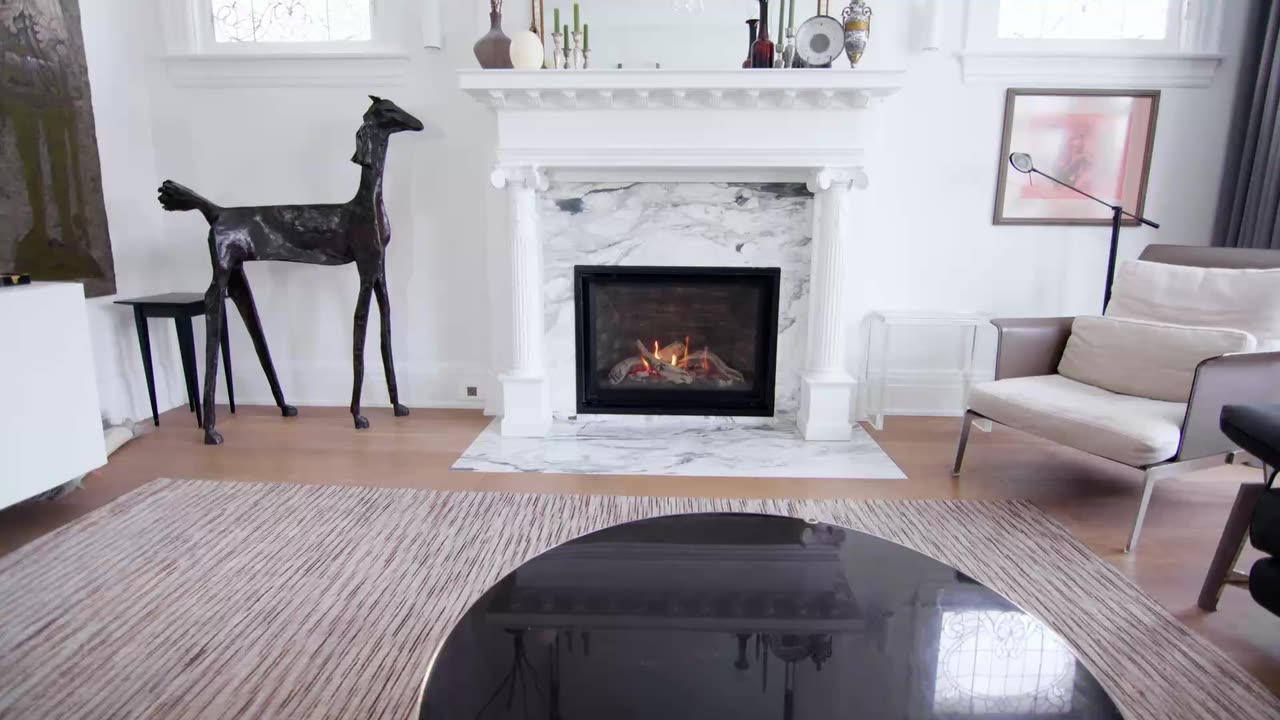Fireplace and sculptural furniture in a bright living room